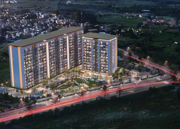 Gulnaar Zenium RERA-approved 4+1 BHK luxury apartments in Zirakpur with illuminated towers, landscaped gardens and main entry