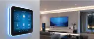 Luxury living room at Gulnaar Zenium with wall-mounted smart home automation panel controlling TV, lighting and climate