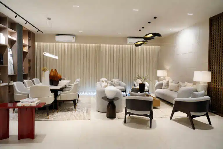 Gulnaar Zenium elegant open-plan living and dining space with plush sofas, dining chairs and modern pendant lighting