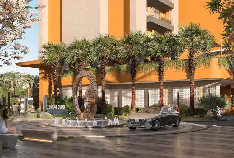 Gulnaar Zenium grand arrival lobby exterior with circular sculpture, fountain, palms at clubhouse entrance